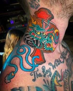 Get a fierce yet charming Japanese dragon tattoo on your neck by the talented artist Eddy Ospina.
