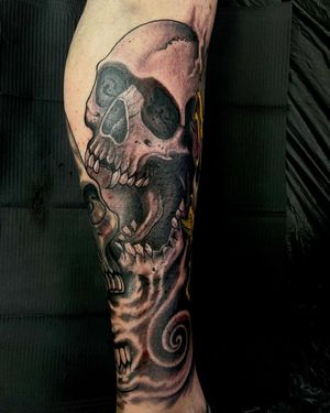 Detailed black and gray skull design by tattoo artist Fernando Joergensen, perfect for a bold and edgy look.