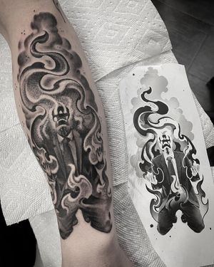 A striking blackwork tattoo by Rico Dionichi featuring a candle surrounded by flames on the forearm.