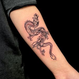 Elegant fine line dragon design by Fernando Joergensen, perfect for your forearm. Make a bold statement with this intricate piece.