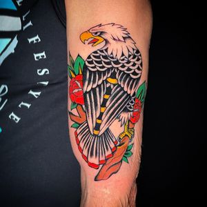 Impressive illustrative piece by Chris Tambo featuring a classic eagle and flower design on the upper arm