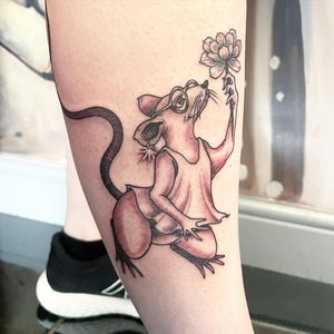 Elegant black and gray tattoo featuring a flower and rat, expertly done by Fernando Joergensen on the lower leg.