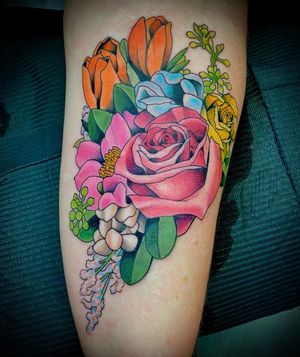 Vibrant neo-traditional flower tattoo on lower leg by the talented artist Darren Brass.