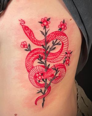 Intricate Japanese design by Fernando Joergensen, featuring a beautiful snake and flower motif on the ribs.