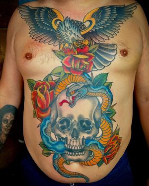 A stunning illustrative traditional tattoo featuring a snake, eagle, flower, and skull. Visit Darren Brass for your next tattoo masterpiece!