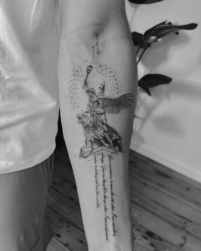 Fine line blackwork tattoo featuring a geometric design of a lion and angel with a small illustrative quote on the forearm, by Gabriele Edu.