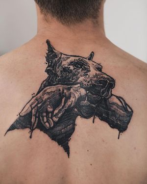Blackwork upper back tattoo featuring a stunning illustrative design of a dog by talented artist Jamie B.