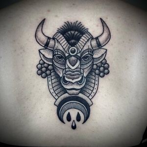 Lamat's black and gray dotwork masterpiece featuring a bull motif with intricate drops, perfect for the upper back.