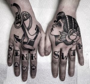 Beautiful black and gray hand tattoo by Lamat featuring classic motifs of rose, anchor, and woman.