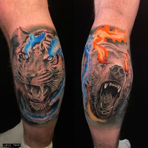 Capture the strength and beauty of a bear and tiger in this stunning lower leg tattoo by Marie Terry.