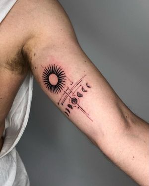 Experience the harmonious blend of sun and moon motifs in this intricate black and gray mandala tattoo by Gabriele Edu.
