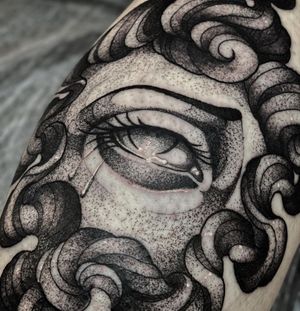 Beautiful black and gray dotwork design featuring an intricate pattern, eye, and tears, by the talented artist Lamat.