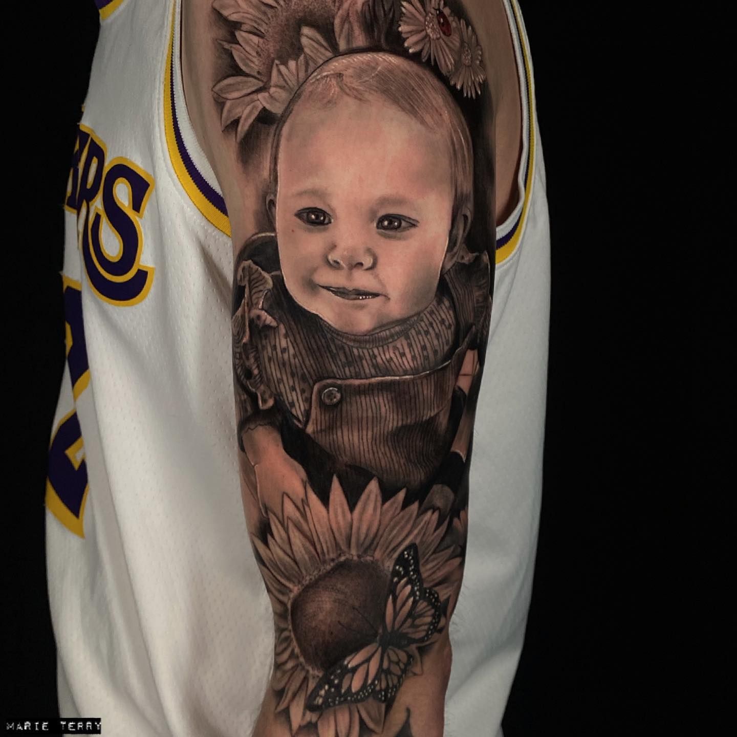 realistic-baby-and-flower-sleeve-tattoo-tattoodo
