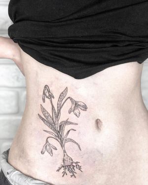 Beautiful blackwork and illustrative design by Alisa Hotlib, combining delicate fine line flower with bold onion motif.