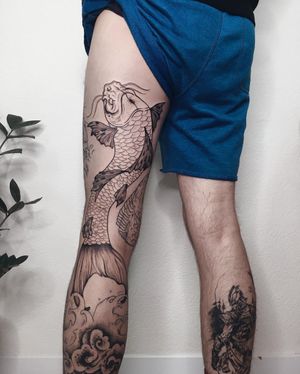 Illustrative design by Anna featuring a majestic koi fish swimming through intricate waves, perfectly placed on the knee.