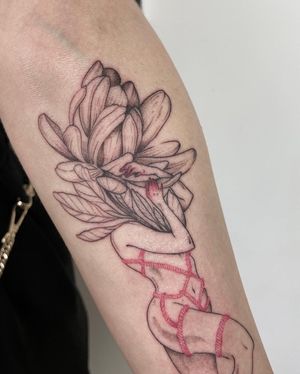 Beautiful blackwork forearm tattoo of a woman intertwined with a rope and flower, executed by talented artist Anna.