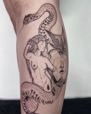 Unique blackwork tattoo on lower leg by Anna featuring a snake, apple, and woman motif. Perfect blend of art and symbolism.