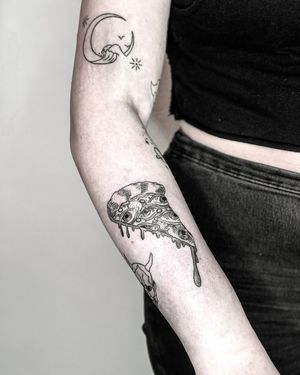 Unique blackwork tattoo on forearm merging pizza and eye motifs by Alisa Hotlib. Illustrative style.