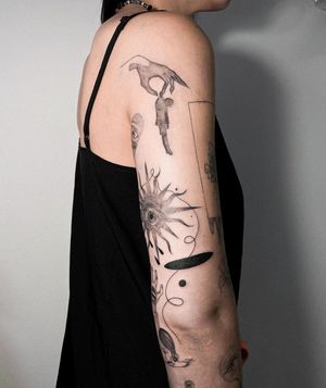 Stunning blackwork tattoo on upper arm by Alisa Hotlib featuring intricate patterns, a sun, a hand, and an eye in fine line illustrative style.