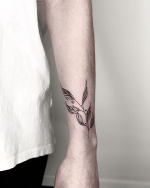 Stunning blackwork leaf design by Alisa Hotlib, perfect for your forearm
