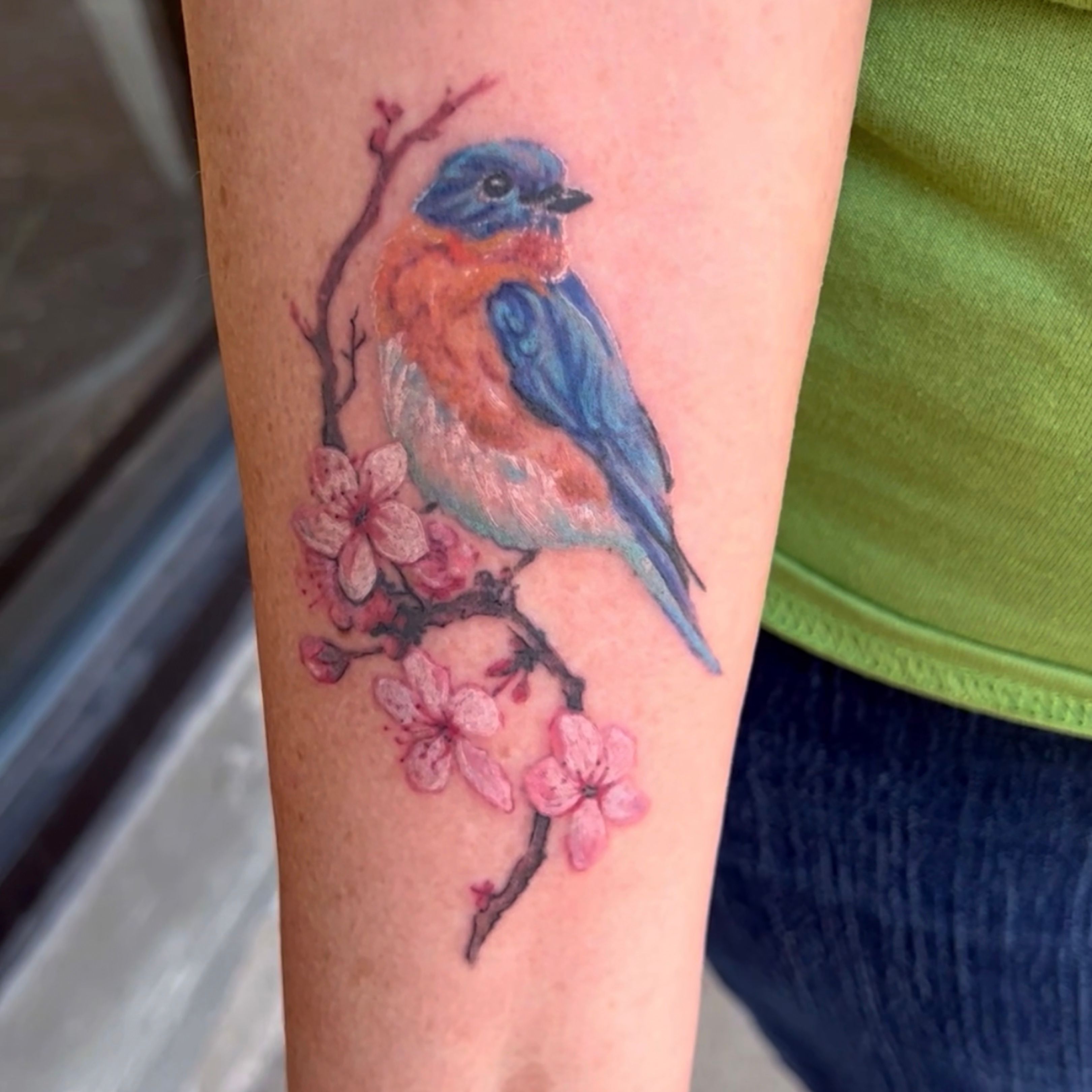 Little Tattoos — Watercolor style surrealist blue bird holding a...