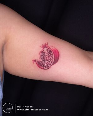 Color Pomegranate Tattoo done by Parth Vasani at Circle Tattoo Studio