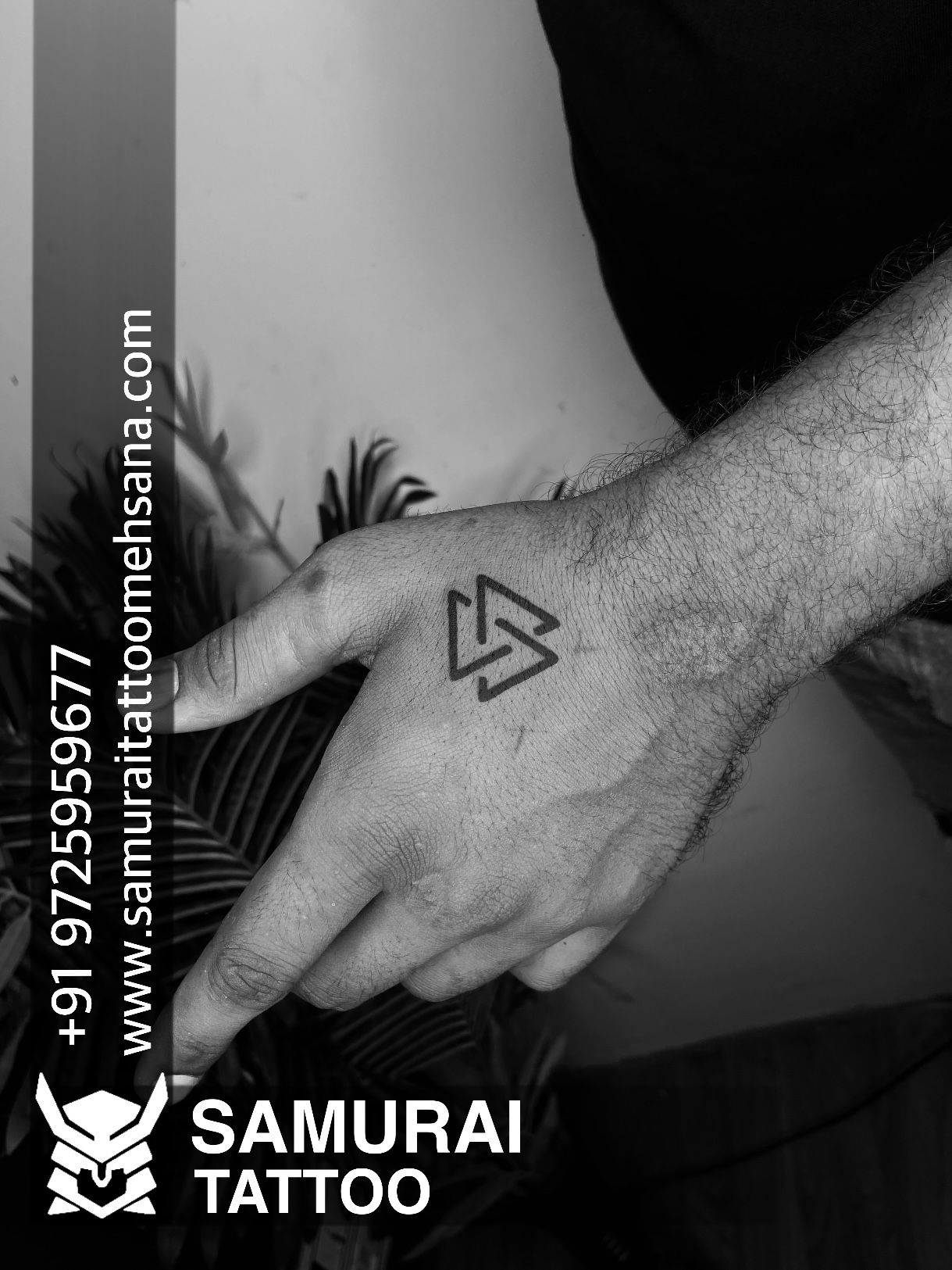 Handpoke minimalist tattoo Detail triangles dots and circle stock photo
