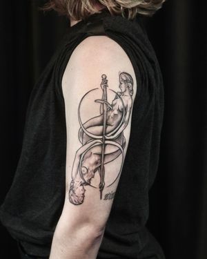 Bold blackwork sword and woman illustration on upper arm by Slava. A powerful and fierce design.