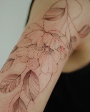 Adorn your upper arm with a stunning and detailed illustrative flower tattoo created by the talented artist, Alisa.