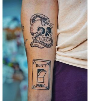 Unique blackwork design with lettering and illustrative elements by Lim, featuring a snake, skull, quote, and switch motif.