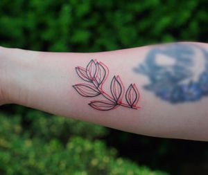Get a striking blackwork tattoo of a beautiful leaf design on your forearm by the talented artist Lim.