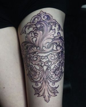 Elegant blackwork design by Slava featuring intricate filigree motifs, beautifully illustrated on the upper leg area.