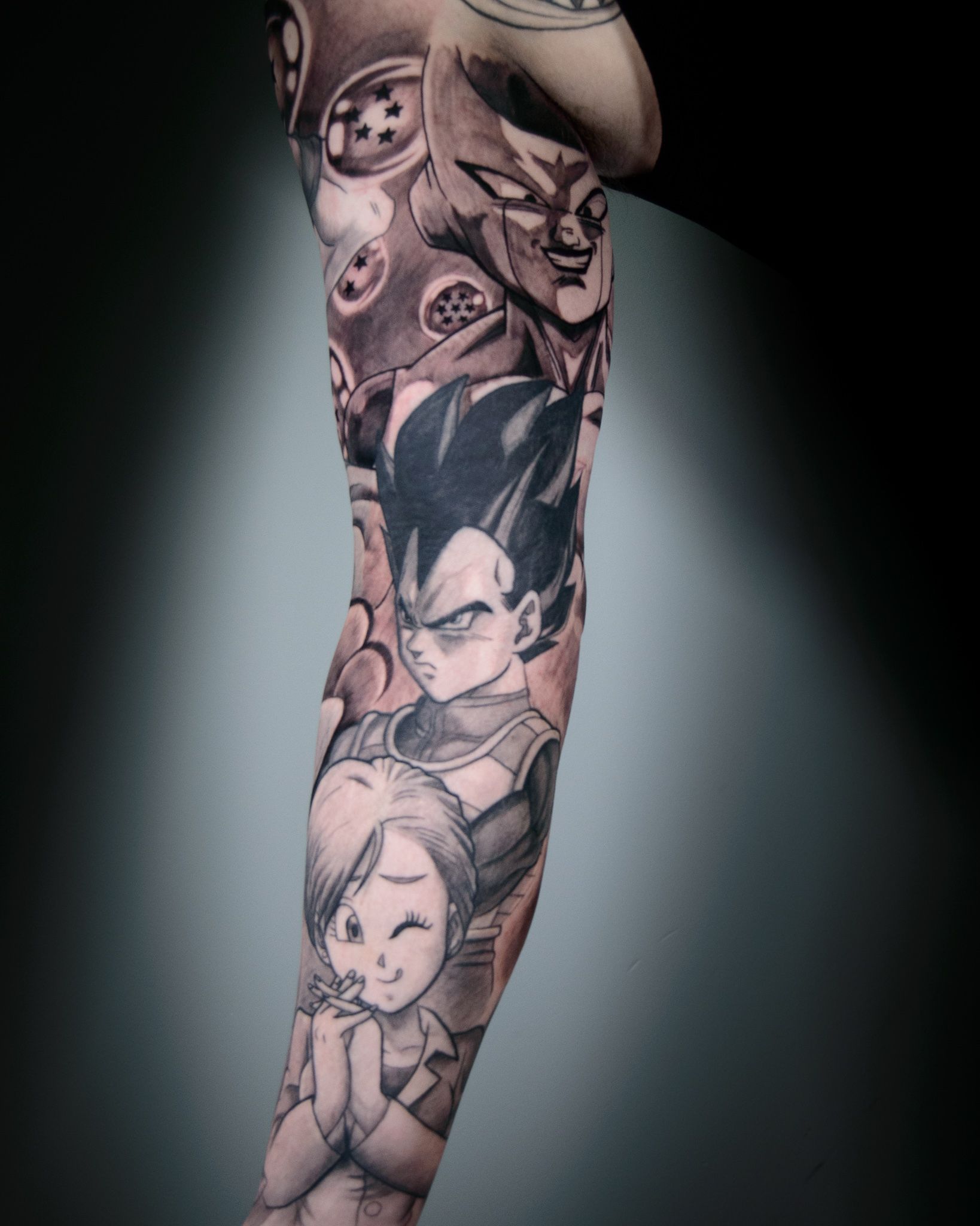 Vegeta tattoo on the calf.