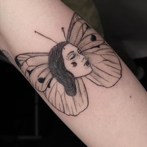 Capture the beauty and grace of a woman and butterfly through Mané's blackwork style. Perfect for your forearm.