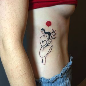 Baingio's illustrative blackwork tattoo on ribs, featuring a sun, flower, woman, and sprig.