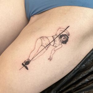 Illustrative tattoo on upper leg by Mané featuring a graceful woman pole dancing.