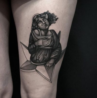 Celestial beauty meets boldness in this blackwork illustrative tattoo on the upper leg by Joanna.