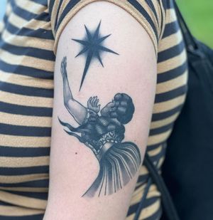 Unique blackwork tattoo of a starry night woman on upper arm by Joanna. Illustrative style.