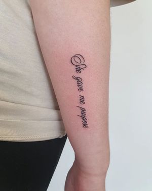 Express your inner calm with this handwritten quote tattoo by Dorota on your forearm, a reminder to find grace in life's chaos.