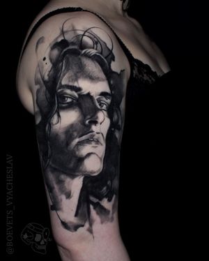 Get a striking blackwork and illustrative style tattoo of a man, expertly executed by Slava.