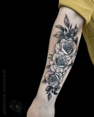 Beautiful blackwork flower tattoo on forearm, created by Slava. A timeless and elegant addition to your body art collection.