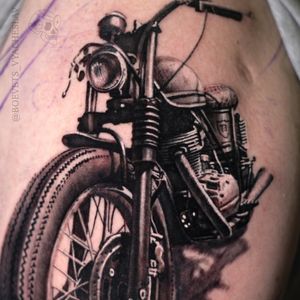 Bold blackwork illustrative motorcycle tattoo on chest by Slava. Ride in style!