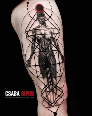 An ornamental and illustrative upper arm tattoo featuring a striking blackwork design of a man within intricate geometric patterns, by Csaba Sipos.