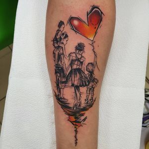 Celebrate love and family with this blackwork forearm tattoo featuring a heart balloon, woman, man, kid, and a dancing family. Designed by the talented artist Dorota.