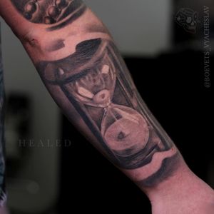 Capture the passage of time with this stunning blackwork hourglass tattoo by Slava. Get timeless art now!