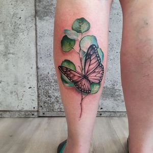 Vibrant and detailed neo-traditional butterfly tattoo on the lower leg by artist Dorota. An illustrative masterpiece!