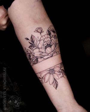 Elegant forearm tattoo by Slava, blending ornamental and illustrative styles for a stunning design.