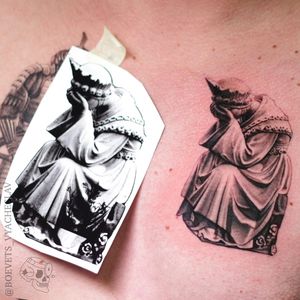 Experience the beauty of blackwork and realism in this stunning illustrative tattoo of a woman's statue by the talented artist Slava.