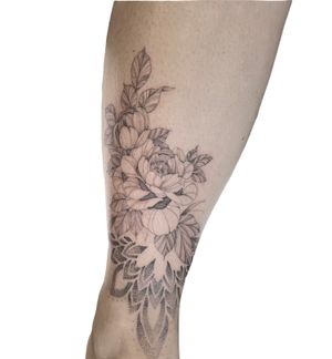 Elegant floral design by Federico Colantoni, perfect for lower leg placement. Intricate dotwork details bring this peony mandala to life.