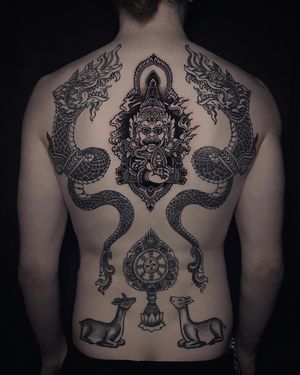 Request & Inquiry 👉 DM or 📧 ; Virupaksha, the finale of full back project for Hendrik. 🙏 Nāga dragons (8months), Dharmachakra & Deers (1year) healed. #customtattoo #virupaksha #naga #dragontattoo #thailand #tibetantattoo #dharmachakra #buddhisttattoo #tattooart #backtattoo #backpiece #tattoodesign #tattooideas #tätowierer #berlintattooers #berlintattooartist #tattooberlin #berlintattoo #tattoogermany #tätowierung #inked #blackwork #blackworkers #tattooworkers #tattoodo #tats #inkedmag #tattooshop #tattoolove #tattoovideo
